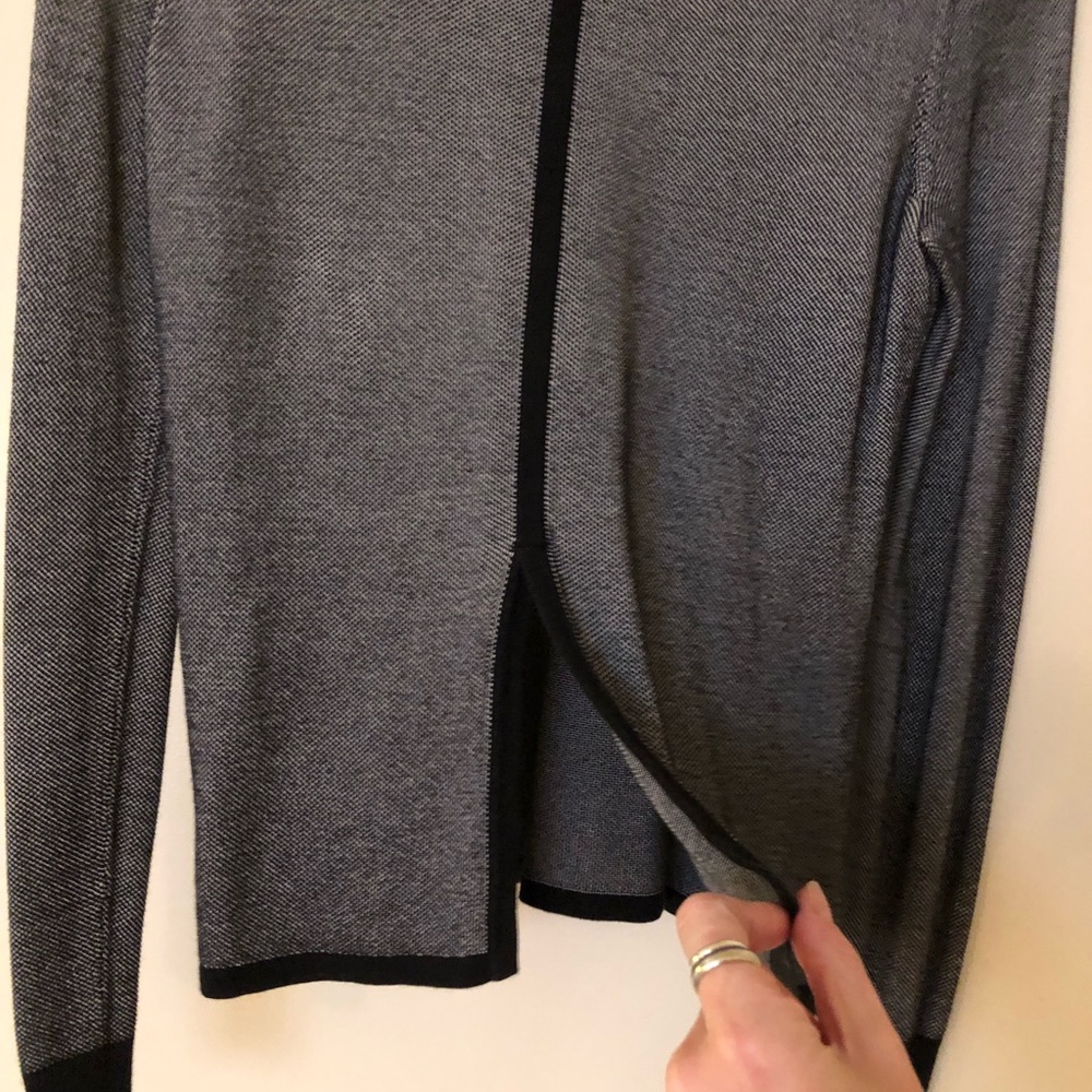 Long sleeve crop with slit in the back. Conservative with a twist!